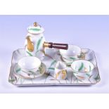 A French porcelain hot chocolate set on tray by Delvaux decorated in the Oriental taste with tall