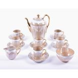A Phoenix China coffee set comprising coffee pot, milk jug, sugar bowls and six coffee cans and
