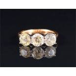 An 18ct yellow gold and diamond ring set with three round brilliant-cut diamonds of approximately