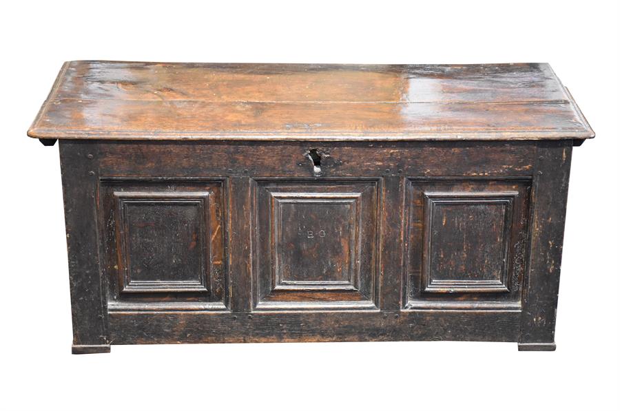 An 18th century oak panelled coffer with twin plank top and a triple panelled front. 104 cm wide.