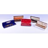 A collection of mid 20th century boxed pens comprising a Parker fountain pen and ballpoint set, (the