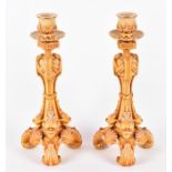 A pair of Royal Worcester blush ivory candlesticks modelled in the Regency manner with three