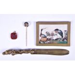 A small group of objets d'art including an intaglio, a horseshoe agate pin, a letter opener and a