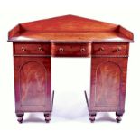 A small Regency mahogany pedestal sideboard the frieze back with beaded edges, over a breakfront