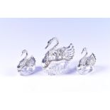 Three novelty silver mounted cut glass bowls in the form of seated swans with hinged pierced