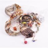 A small quantity of costume jewellery to include several silver rings, various beaded necklaces,