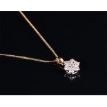 An 18ct yellow gold and diamond floral cluster pendant the seven round brilliant-cut diamonds of