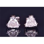 A pair of trillion-cut diamond ear studs each set with a trillion-cut diamond of approximately 2.0