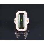 An 18ct yellow gold, diamond, and green tourmaline ring set with an emerald-cut bottle green