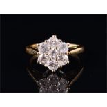 An 18ct yellow gold and diamond floral cluster ring set with seven round brilliant-cut diamonds of