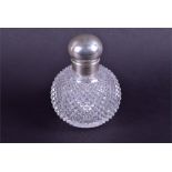 A large hobnail cut-glass scent bottle with white metal screw cap, 13 cm high.