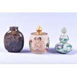 An early 20th century erotic Chinese porcelain snuff bottle and two others lovers sit in a bath