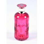 A 20th century silver and enamel topped scent bottle the cranberry glass body with cut decoration,