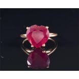 A 9ct yellow gold and ruby ring set with a heart-shaped ruby (approximately 12 mm wide), size Q, 3.5