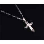 An 18ct white gold and diamond cross-shaped pendant set with black and white diamonds, 2.5 x 2 cm,