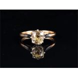 An 18ct yellow gold and solitaire diamond ring set with an old mine-cut diamond of approximately 1.