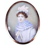 A fine 19th century portrait miniature on ivory of a finely dressed young lady facing forward,