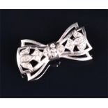 A white metal and diamond bow brooch set with twenty-three round brilliant-cut diamonds, 3.2 cm