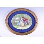 A large late 19th / early 20th century hand painted porcelain panel of oval form a courting couple