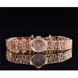 A Rotary 9ct gold ladies wristwatch with bark effect strap, 17.4 grams without movement, and a