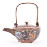 A Japanese Meiji cloisonne enamel teapot and cover finely decorated with roundels of dragons, dogs
