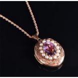 A 9ct yellow gold, amethyst, and pearl locket in the Victorian style, of oval form,10 grams,