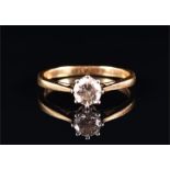 A solitaire diamond ring set with a round brilliant-cut diamond of approximately 0.75 carats, on a