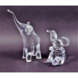 Two large Daum French crystal models of elephants  the largest standing at 24 cm high, the other