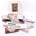 A large collection of assorted postcards and stamps including a number of first day covers.