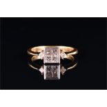 An 18ct yellow gold and diamond ring the square-cut mount calibre-set with four square-cut diamonds,