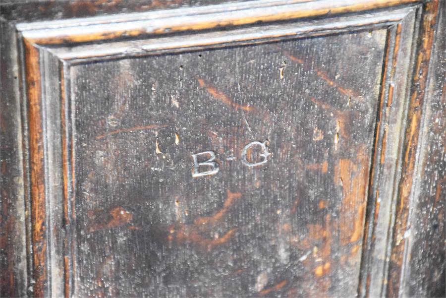 An 18th century oak panelled coffer with twin plank top and a triple panelled front. 104 cm wide. - Image 3 of 4