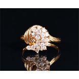 An 18ct yellow gold and diamond cluster ring of naturalistic design, set with round brilliant-cut