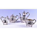 A matched Victorian four-piece silver tea set the coffee pot by Charles Boyton London 1867, 25cm
