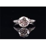 A platinum and solitaire diamond ring set with a round brilliant-cut diamond of approximately 2.0