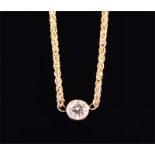 A 14ct yellow gold and diamond pendant the collet-set solitaire diamond of approximately 0.40