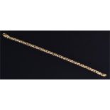 An 18ct yellow gold flattened curb link bracelet 22 cm long, 14 grams.