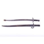 A 19th century French chassepot bayonet and scabbard impressed marks to both, the bayonet numbered