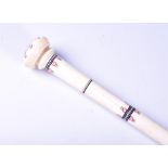 A late 19th century ivory walking cane in two sections with screw fitting, the tapering shaft