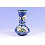 A Royal Doulton Faience vase decorated in the style of the Aesthetic movement of bulbous form with