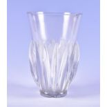 A Lalique clear glass vase of tapering form with vertical ribbed detail, incised and beaded borders,