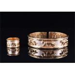 An unusual white and yellow metal articulated cuff bangle the white metal band decorated with a