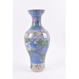 A 19th century Chinese blue and famille rose vase of baluster form, with rouleau neck, decorated