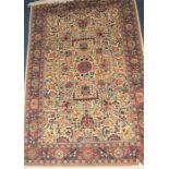 A 20th century Persian part silk carpet the central mushroom ground decorated with tigers, deer