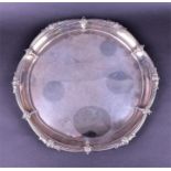 A George V silver salver Sheffield 1915 by Walker & Hall, the shaped rim with scrolled decoration,