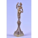 A cast brass Art Deco figure of a female nude the figure holds a basket of flowers to her left