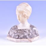 A 19th century French carved marble and alabaster bust of a young woman wearing a headscarf, and