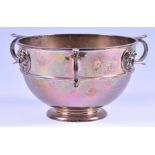 An Edwardian silver three handled bowl London 1904, by Goldsmiths & Silversmiths, with three