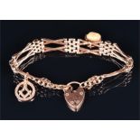 A 9ct rose gold articulated link bracelet suspended with a 9ct rose gold Masonic pendant charm,