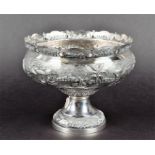 An Eastern sterling silver pedestal bowl decorated with a hunting scene of archers in pursuit of