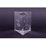 A Kosta Sweden crystal prism paperweight decorated with etched fish, stars and constellations and